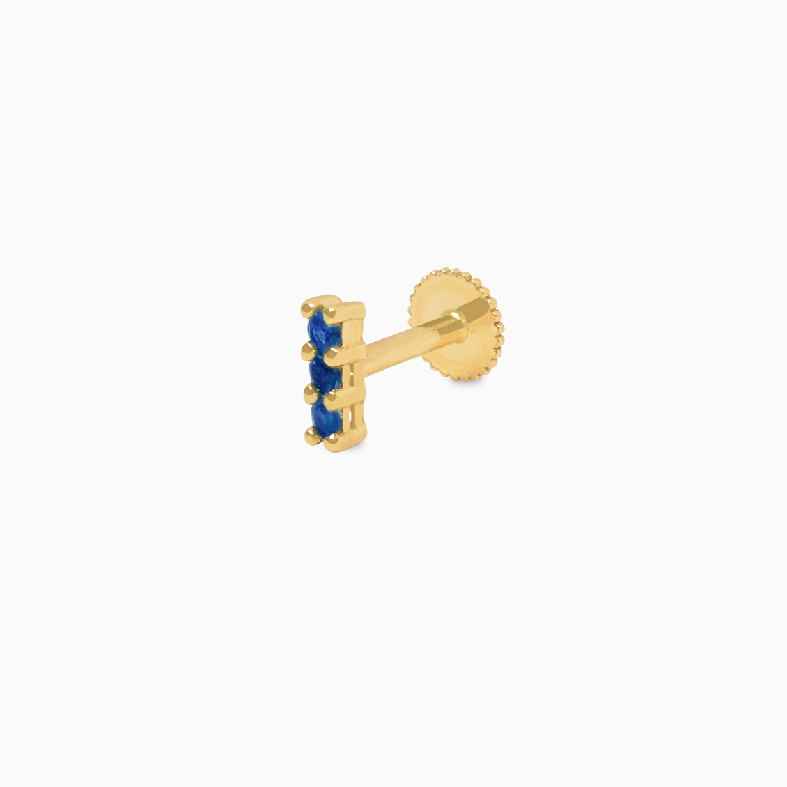 Piercing en oro amarillo de 18K barrita con zafiros