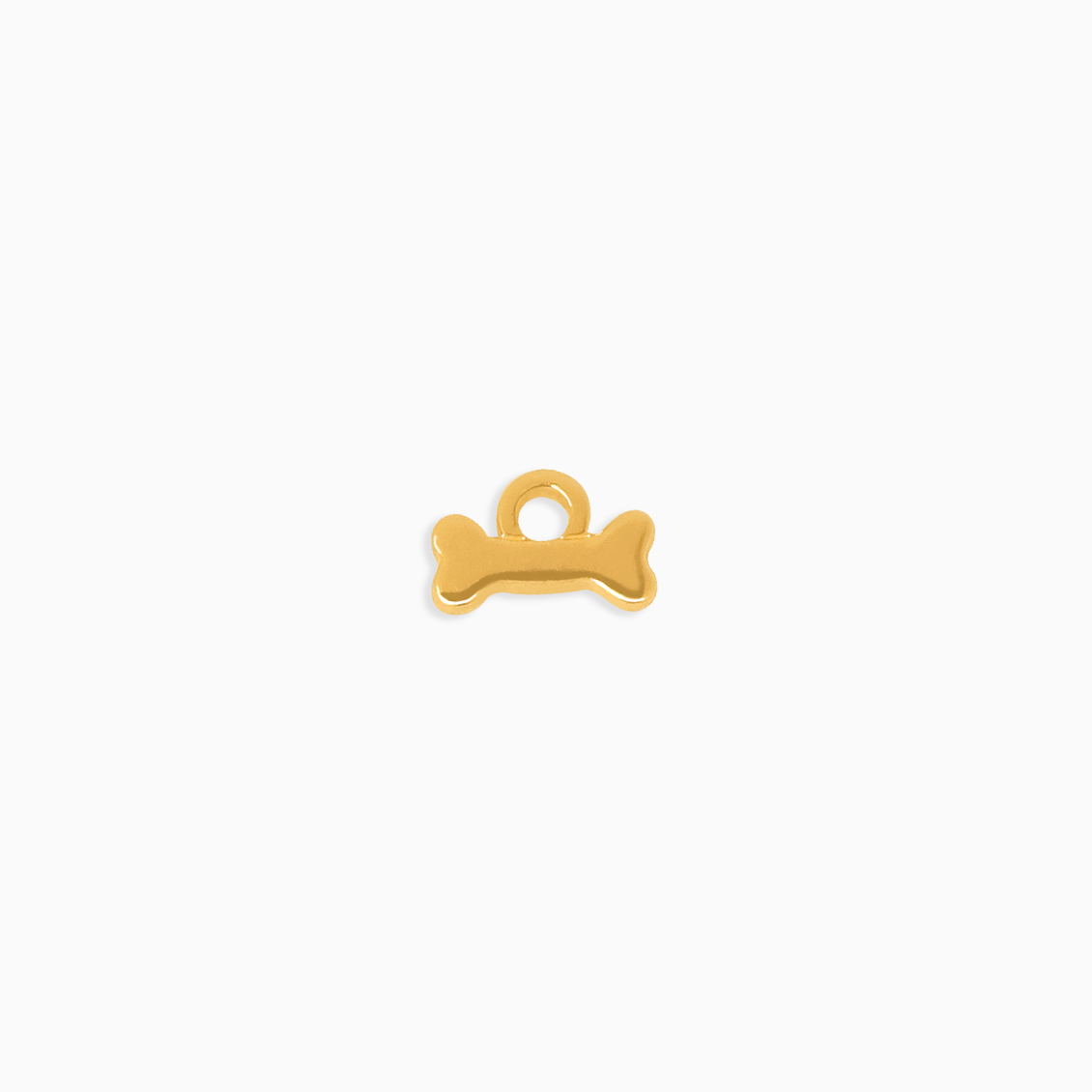 Charm en oro amarillo de 18K hueso