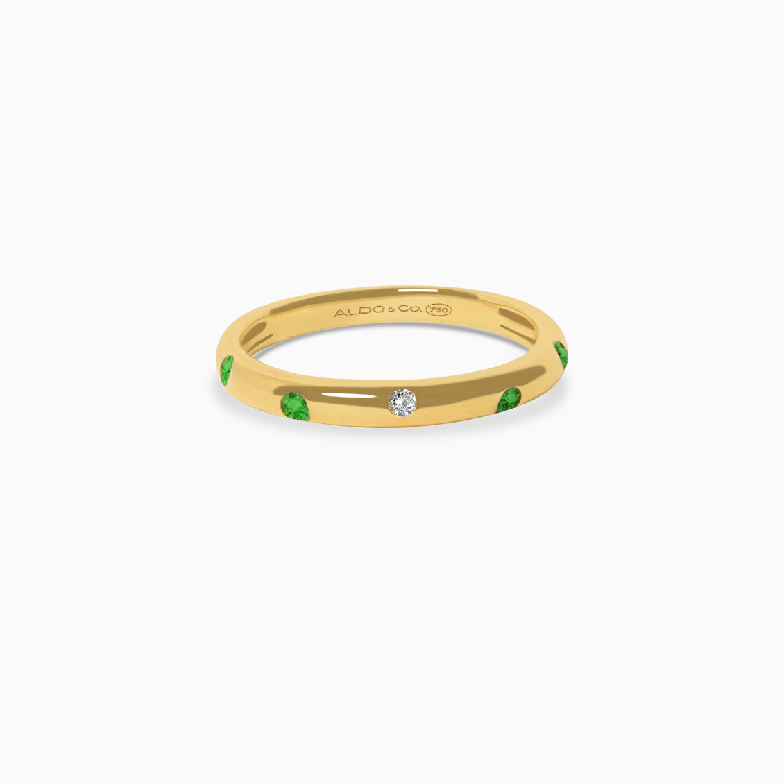 Anillo en oro amarillo de 18K media caña con esmeraldas