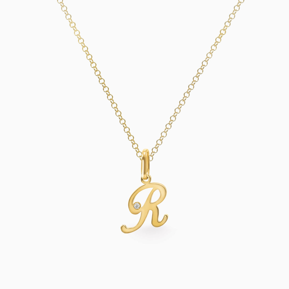 Dije en oro amarillo de 18K letra R