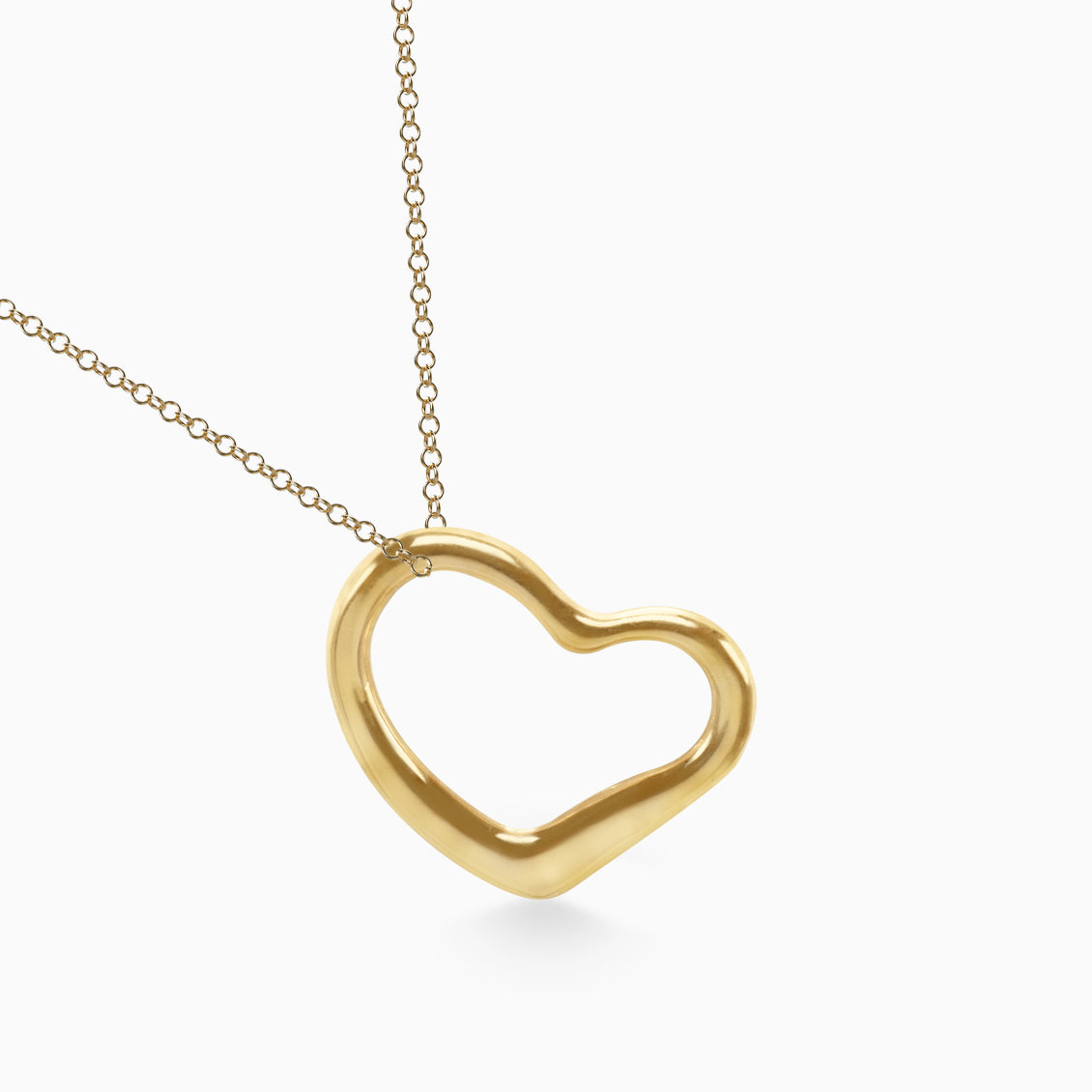 Dije en oro amarillo de 18K en forma de corazón